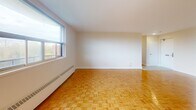 Located at 32 Clayland Dr in Toronto's M3A neighbourhood, this 2-bedroom, 1-bathroom unit offers a well-organized layout across a single floor. Warm parquet flooring runs throughout the living spaces and bedrooms, adding a classic character to the interior.

The combined kitchen and living room area forms the heart of the unit. The living room is generously proportioned, bathed in natural light from large windows that offer views of the surrounding greenery. Baseboard heating runs along the walls, ensuring comfort throughout the seasons. The kitchen is functionally laid out with white cabinetry, a tiled floor, and includes a stove, providing direct sightlines to the balcony access — a convenient feature for everyday living.

The two bedrooms are bright and well-sized, each featuring parquet floors, neutral walls, and windows that let in natural light. The primary bedroom offers a comfortable footprint with a built-in closet. The second bedroom is similarly appointed, providing flexibility for use as a guest room or home office.

The bathroom is clean and practical, featuring a full-sized bathtub with a tiled surround and chrome fixtures. A private balcony completes the unit, offering an outdoor retreat with views of the neighbourhood.