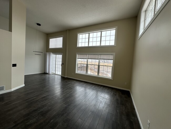 Living room with a dining area - 813 Alysheba Rd