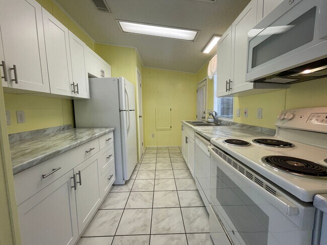 Building Photo - 2 BR 2 BATH Annual Rental in Barefoot Bay Available JUNE 2025