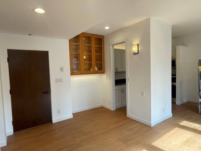 Entryway with custom-built book shelf/hutch that lights up - 2700 4th Ave