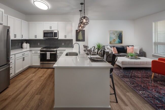 Built in breakfast bars with solid surface counters - Mill District Apartments