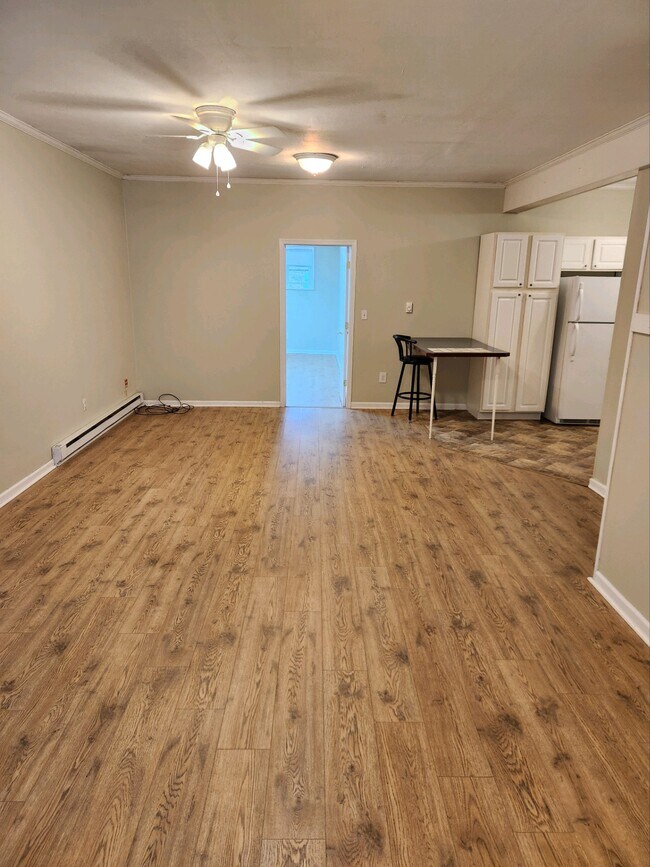 Spacious family/living room facing bedroom, adjoining kitchen - 224 River Rd