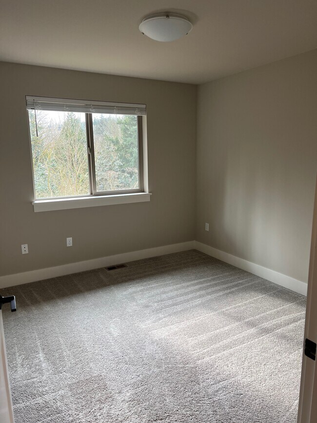 Carpeted bedroom with greenbelt views - 6121 NE 195th Pl