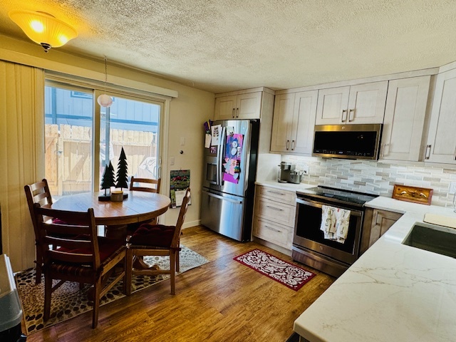 Kitchen with table - 330 W 4th St
