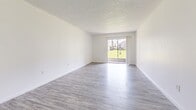 Located at 693 Wymore Road in Altamonte Springs, FL, this single-floor, one-bedroom, one-bathroom residence offers a well-organized and thoughtfully designed layout. Light-toned luxury vinyl plank flooring runs throughout the main living areas, complemented by crisp white walls and textured ceilings that give the space a clean, modern aesthetic.

The combined living and dining area is bright and open, benefiting from natural light streaming through a large sliding glass door that leads to a private balcony with pleasant outdoor views of the surrounding greenery. The space flows seamlessly, making it ideal for both everyday living and entertaining.

The kitchen is a standout feature, showcasing white shaker-style cabinetry, dark granite countertops, a mosaic tile backsplash in neutral earth tones, and stainless steel appliances. A pantry provides additional storage, keeping the kitchen functional and organized.

The spacious primary bedroom offers a generous footprint with a natural light source from a dedicated window and convenient access to multiple closets, providing ample storage. The bathroom features a full tub-shower combination with white tile surround, complemented by dark hardwood-style flooring. A dedicated laundry area adds everyday convenience to this well-appointed residence.