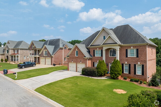 Many homes in Villa Rica carry grandeur, such as this row of red brick homes.