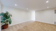 Located at 8919 Longden Ave in Temple City, CA, this single-floor 2-bedroom, 1-bathroom home offers a well-organized and efficiently laid out living space. The interior is finished with a clean, neutral palette throughout, creating a bright and cohesive atmosphere. Recessed lighting illuminates every room, complementing the soft beige carpeting found in both bedrooms, the living room, and the hallways.

The galley-style kitchen is a standout feature, showcasing white shaker cabinetry with brushed nickel hardware, quartz countertops, a stainless steel sink, and stainless steel appliances including a gas range, microwave, and dishwasher. Light tile flooring and ample cabinet storage make this kitchen both functional and visually appealing.

The primary bedroom is generously sized, with recessed lighting and direct access to the bathroom. The second bedroom features mirrored sliding closet doors that enhance the sense of space. In total, the home includes four closets, providing abundant storage throughout.

The bathroom is finished with a white vanity, quartz countertop, gold-toned fixtures, a medicine cabinet mirror, and tile flooring. The home also includes a dining room, a living room, two hallways, and access to an outdoor patio, rounding out the functional and comfortable layout of this Temple City residence.