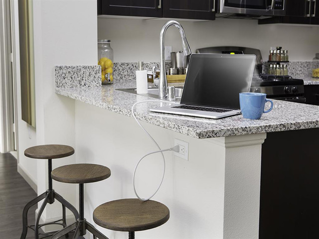 Prep and create on durable luxury. Kitchens and baths at Skye have creamy polished granite countertops. - Skye Apartments