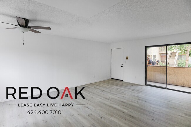 Building Photo - Bright and Spacious Two Bedroom With Stain...