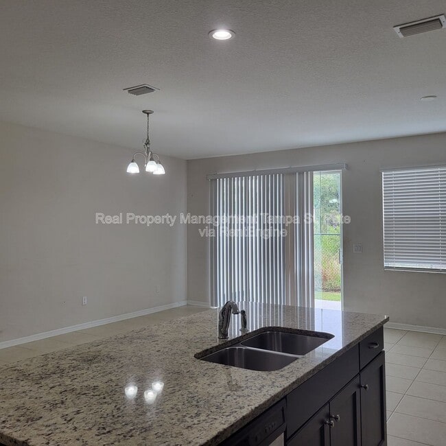 Building Photo - 6409 Tillandsia Pl