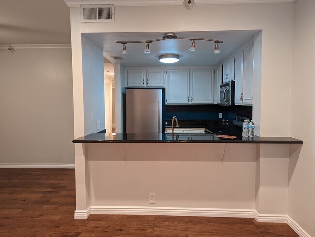 Living room, kitchen, & part of dining area (left side) - 730 W 4th St