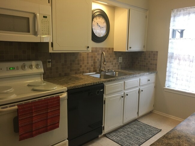 Kitchen with bar area - 219 W 8th St