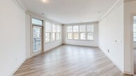 This contemporary 1,050 square foot home in Concord, NC offers a blend of style and functionality. The single-story layout comprises three bedrooms, including a generous 230 square foot primary bedroom, and one full bathroom. The heart of the home is an open-concept living area, seamlessly connecting the kitchen and living room.

The kitchen is a standout feature, boasting sleek white cabinetry that extends to the ceiling, maximizing storage space. Stainless steel appliances, including a side-by-side refrigerator and built-in microwave, add a modern touch. The eye-catching mosaic tile backsplash introduces texture and visual interest, while granite countertops provide ample workspace.

Throughout the home, light-toned wood-look flooring creates a cohesive and airy feel, with plush carpeting in the bedrooms for added comfort. Large windows, some with plantation shutters, flood the rooms with natural light and offer views of the surrounding area. The bathroom features a granite-topped vanity and a shower/tub combination with a glass enclosure.

Additional amenities include a ceiling fan in the bedrooms, recessed lighting, and a private balcony accessible from one of the rooms. The home also offers two closets for storage. With its thoughtful design and contemporary finishes, this property presents an attractive option for modern living in Concord.
