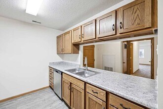 Our open-concept layouts make entertaining effortless, blending kitchen and living spaces for a warm, inviting atmosphere. - Northbrook Apartments