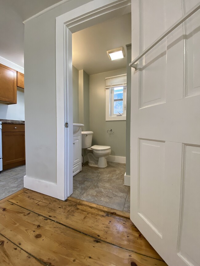 Updated bathroom, off kitchen and main room, tile floor - 5 Chapel St