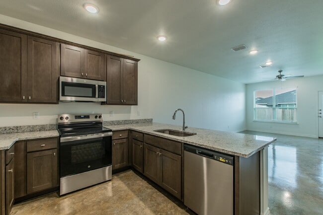 Building Photo - Brand New 3BR Duplex with Modern Concrete Floors & Fenced Yard!