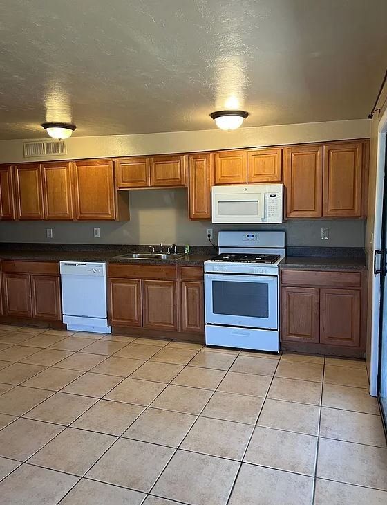 Building Photo - 6027 S Lostan Ave