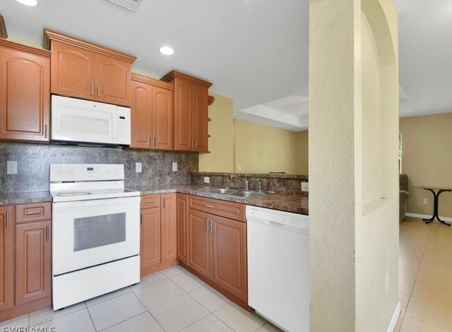 The kitchen, the stove, the microwave does the kitchen - 224 Homer Ave S