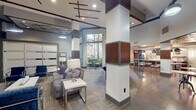 Located at 250 Congress Park Dr in Delray Beach, Florida, this well-appointed clubhouse offers a generously sized, single-level layout designed for community gathering and recreation. The space is defined by its dramatic soaring ceilings, which create an airy, open atmosphere throughout. Architecturally distinctive columns with textured wood-panel accents serve as visual anchors, complementing the interplay of neutral tones, gray-blue color accents, and warm wood-patterned flooring laid in a herringbone pattern.

Floor-to-ceiling windows flood the interior with natural light and frame views of lush Florida palm trees outside, seamlessly blending the indoors with the surrounding landscape. The open-plan layout accommodates multiple functional zones, including a comfortable lounge area with plush seating, a billiards table as a central recreational feature, and bar-height tables with stools ideal for casual socializing. A kitchenette or refreshment bar area with pendant lighting adds convenience for residents and guests.

A built-in banquette with upholstered seating provides an intimate nook, while frosted glass partition panels define quieter areas without closing off the open feel. The ceiling details, featuring cross-beam decorative elements with dark wood and red accents, add architectural character. The overall ambiance is modern, polished, and welcoming — reflecting a resort-inspired design sensibility suited to South Florida living.