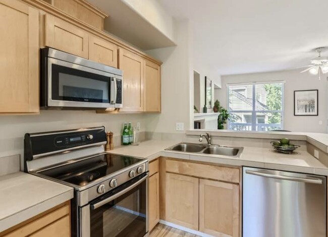 Kitchen with microwave and elective stove and oven - 2871 NW Kennedy Ct