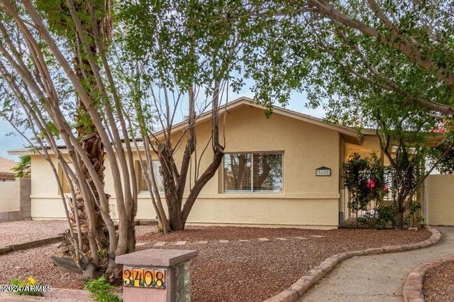 Building Photo - 3408 W Port Au Prince Ln