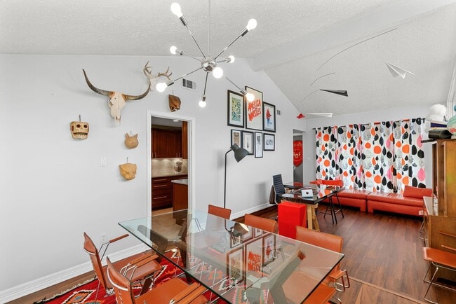 Dining room/office area with raised ceiling and tons of natural light... and paper airplane mobile! - 1178 Bournewood Dr