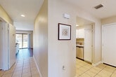 Located at 21495 LeMay Dr in Riverside, CA, this single-story home offers a thoughtfully designed layout across two bedrooms and two bathrooms. The entryway opens to a hallway connecting the main living areas, with tile flooring that transitions into wood-look flooring in the combined living and dining space. The living area is bright and inviting, with a sliding glass door that brings in natural light and leads to the patio. Adjacent to the entry, the kitchen features white cabinetry, granite countertops, a tray ceiling with recessed lighting, stainless steel appliances including a refrigerator, range, microwave, and dishwasher, and tile flooring throughout. A separate dining area provides additional space for meals and entertaining. The spacious primary bedroom is carpeted and well-lit with a window, offering generous room for furnishings. The second bedroom also features carpet, a large sliding closet, and ample storage. The bathrooms are finished with tile flooring, and the home includes a dedicated laundry area and utility room. An attached garage with an epoxy-coated floor and built-in windows adds practical convenience. With six closets throughout, storage is plentiful in this well-organized home.
