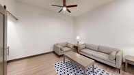 Located at 627 Emma Ave in Springdale, AR, this thoughtfully designed 2-bedroom, 2-bathroom unit offers a clean, modern aesthetic across a single floor. The open-concept kitchen and living area serves as the heart of the home, featuring two-tone shaker cabinetry in gray and white, a white subway tile backsplash, granite countertops, a peninsula with bar seating, and a full suite of stainless steel appliances. Recessed lighting and stylish pendant fixtures illuminate the kitchen, which flows seamlessly into the living area. The living room offers generous ceiling height, a ceiling fan, and light wood-style flooring that carries throughout the unit, creating a cohesive and airy feel. The primary bedroom is a comfortable retreat, highlighted by a large window that brings in natural light, a ceiling fan, and access to a well-appointed closet. The second bedroom also features a barn-style sliding door leading to a built-in desk area, adding functional versatility. Both bathrooms are finished with granite-topped gray vanities and tub-shower combinations. The unit's consistent use of neutral tones, modern fixtures, and durable finishes throughout creates a clean, move-in-ready living environment.
