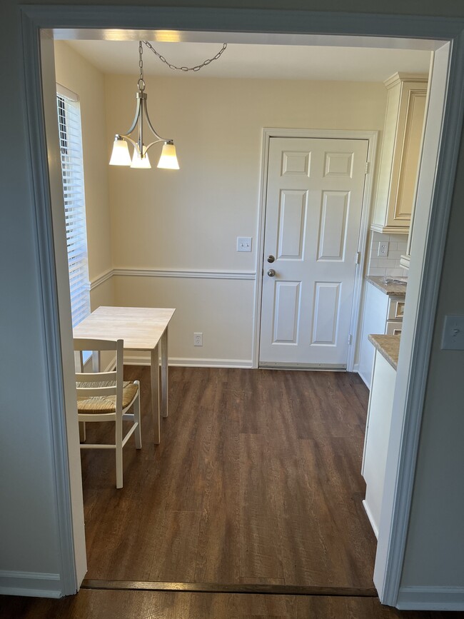 kitchen eating area & garage door - 165 Boxwood Dr