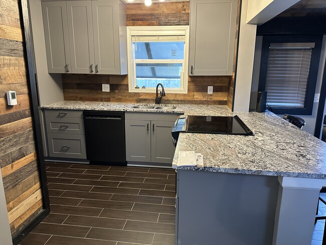 Updated kitchen with new appliances and granite countertops - 2213 E 65th St
