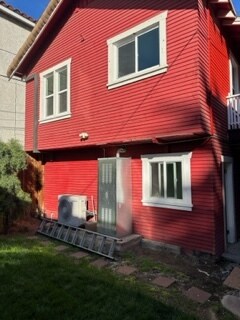 Back of unit from backyard. laundry room is bottom left window - 423 E 8th St