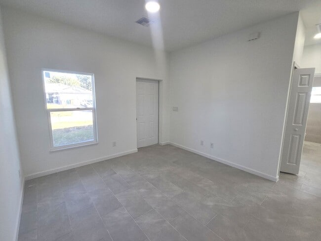 Building Photo - Brand-New Modern 2BR/2BA Home with Garage on Oversized Lot – Prime SW Lehigh Acres Location