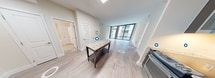 This contemporary apartment, located at 8300 Wisconsin Ave in Bethesda, MD, offers a spacious 1000 square feet of living area on a single floor. The unit boasts three bedrooms, including a primary bedroom of 180 square feet, and two full bathrooms. The open-concept design seamlessly integrates the kitchen and living areas, creating an inviting space for both relaxation and entertainment.

The gourmet kitchen is a standout feature, showcasing dark wood cabinetry, stainless steel appliances, and a convenient center island. The space is further enhanced by under-cabinet lighting and a stylish backsplash. Throughout the apartment, light-toned wood flooring adds warmth and continuity.

Large windows in the living area flood the space with natural light and offer views of the surrounding area. The bathrooms are appointed with modern fixtures, including glass-enclosed showers and granite countertops. Ample storage is provided by two closets, one of which is a walk-in design with built-in shelving.

The apartment's neutral color palette and clean lines create a fresh, contemporary ambiance. High ceilings and recessed lighting contribute to the sense of spaciousness. This well-designed unit combines functionality with style, offering a comfortable and sophisticated urban living experience in a prime Bethesda location.