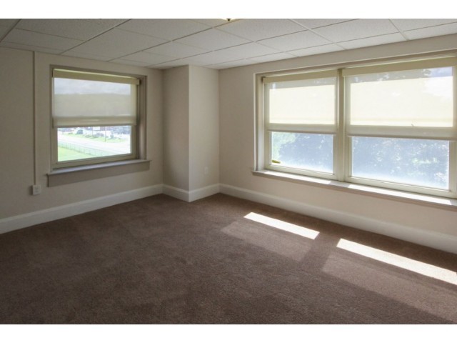 Carpeted bedrooms with large windows - Homeroom Lofts