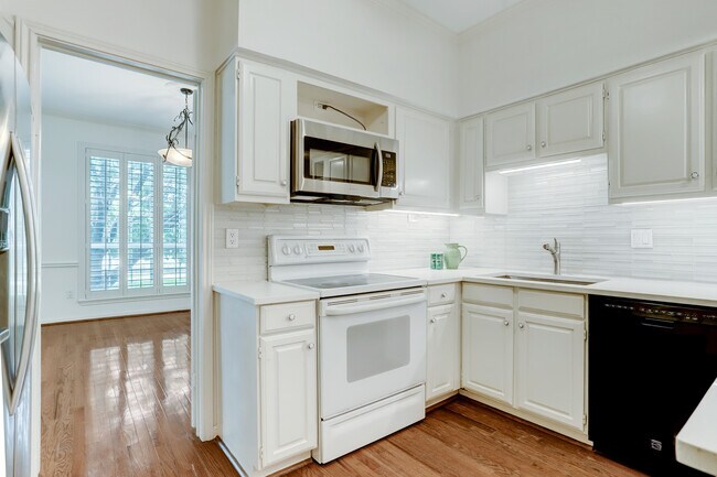 Updated kitchen-quartz counters, glass tiled backsplash. - 2400 N Braeswood Blvd
