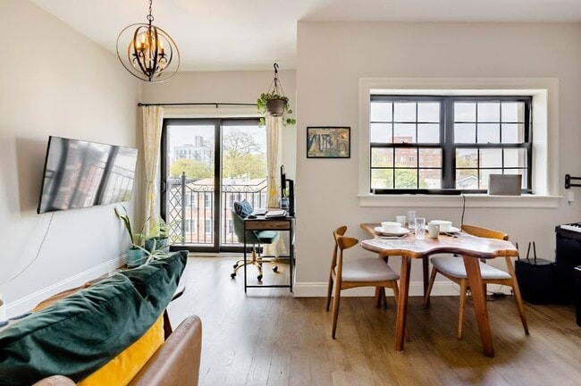 L-shaped layout fits a home office, living, and dining room with tallest-tower city views. - 504 Maple St