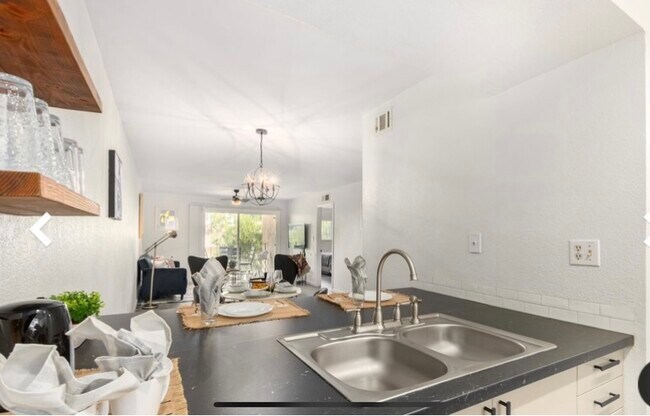 Kitchen into dining and living room - 7430 E Chaparral Rd
