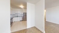 Located on the 7th floor at 2397 Finch Avenue West in Toronto, this well-appointed 2-bedroom, 1-bathroom unit offers a comfortable and functional layout across a single floor. The interior is finished with classic parquet flooring throughout the living and bedroom areas, complemented by clean white walls that create a bright, neutral aesthetic.

The kitchen is thoughtfully designed with white shaker-style cabinetry, a subway tile backsplash, white tile flooring, and a full suite of stainless steel appliances including a refrigerator and dishwasher. It opens toward the living area, allowing for an easy flow between spaces. Large windows in the living area flood the space with natural light and provide views of the surrounding neighbourhood.

The spacious primary bedroom offers generous proportions, a large sliding-door closet, and its own window for natural light. The second bedroom is similarly well-sized with parquet flooring. A dedicated closet provides additional storage. The bathroom features a white vanity with an undermount sink, a large mirror with overhead lighting, and tiled walls and flooring. The overall ambiance is clean, modern, and move-in ready, making it a practical and comfortable home.