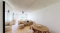 Located at 711 E First St in Sanford, FL, this single-floor, one-bedroom, one-bathroom unit offers a clean and functional layout with a warm, neutral aesthetic throughout. The open-plan living and dining area is filled with natural light, enhanced by large sliding glass doors that frame lush outdoor greenery and provide seamless access to the exterior. Light wood flooring runs through the main living spaces, complemented by crisp white walls and ceiling fans that contribute to an airy, comfortable atmosphere. The dining area accommodates a full table and chairs, flowing naturally into the living space for easy entertaining. The kitchen features classic wood cabinetry, a white subway tile backsplash, tile flooring, and white appliances including an electric range and refrigerator, offering a practical and tidy cooking environment. The bedroom is a well-proportioned, quiet retreat with light wood floors, a ceiling fan, and a window that brings in natural light. Two closets provide ample storage. The bathroom is neatly appointed with a single vanity, mirror with overhead lighting, and tile flooring. A connecting hallway ties the rooms together efficiently. The overall design is simple and cohesive, making this a comfortable and functional space in the heart of Sanford.
