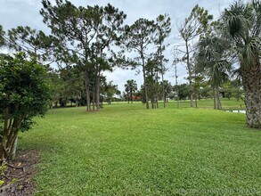 Building Photo - 1803 Palm Beach Trace Dr