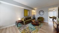 This two-floor residence at 1 Kenilworth Court in Springdale, Ohio offers a well-designed layout across two levels. The living room provides a welcoming atmosphere with light wood-style flooring, neutral gray walls, and ample space for comfortable seating arrangements. Adjacent to it, the dining area features the same flooring and is brightened by a sliding glass door with vertical blinds, allowing natural light to flow in.

The kitchen is thoughtfully designed with gray shaker-style cabinetry, granite-look countertops, a white subway tile backsplash, and stainless steel appliances including a refrigerator, electric range, microwave, and dishwasher. A peninsula with matching countertop offers additional workspace and a pass-through to the dining area, while light wood flooring ties the space together.

The bedrooms are carpeted and offer comfortable proportions, each with neutral walls and good natural light. The primary bedroom is generously sized, while the secondary bedroom provides a cozy retreat. A full bathroom serves the upper level, featuring a tub-shower combo with tile surround, a gray vanity with white countertop, and wood-style flooring. A convenient half bathroom is located on the main level.