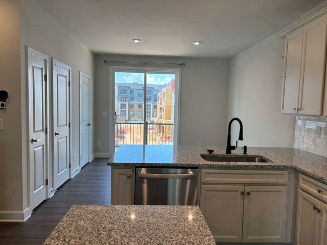 Building Photo - Pristine, move-in ready Townhome located i...