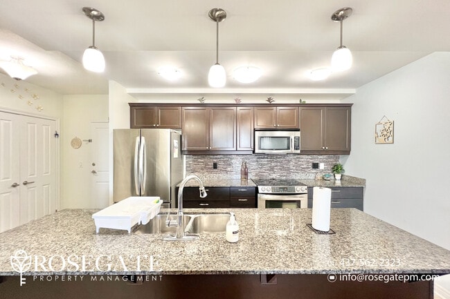 Building Photo - Modern 2-Bedroom + Den Condo with Stunning...