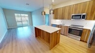 This contemporary apartment in Berwyn, PA, offers 900 square feet of thoughtfully designed living space. The open-plan layout seamlessly integrates the kitchen, living, and dining areas, creating a spacious feel. The kitchen is a highlight, boasting wooden cabinetry, stainless steel appliances, and a central island with pendant lighting.

The apartment features two bedrooms, including a primary bedroom of 150 square feet, each with plush carpeting and ample closet space. Two full bathrooms provide comfort and convenience, with one showcasing a modern tub-shower combination with sleek white tiling.

Throughout the apartment, large windows allow natural light to flood in, enhancing the airy atmosphere. The flooring alternates between warm hardwood in the main living areas and soft carpeting in the bedrooms, adding texture and comfort.

Storage is abundant, with walk-in closets in the bedrooms and additional storage solutions throughout. The unit also includes in-unit laundry facilities for added convenience.

Located at 400 W. Swedesford Road in Berwyn, this apartment combines modern aesthetics with practical living, making it an ideal home for those seeking contemporary comfort in a prime location.