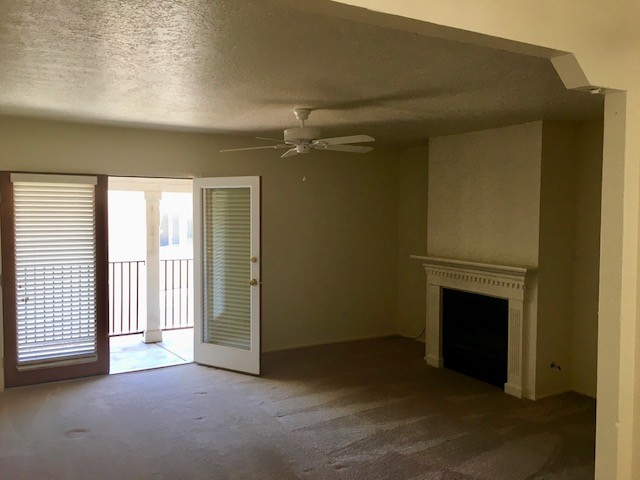 Living room with fireplace - 663 Bishops Lodge Rd