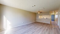 Located at 1846 E Avenue J4 in Lancaster, CA, this single-floor residence offers 2 bedrooms, 3 bathrooms, and a well-organized layout designed for comfortable everyday living. The open-concept living and dining area is bright and welcoming, featuring light-toned laminate flooring throughout, a textured ceiling, and a ceiling fan that enhances air circulation. A breakfast bar connects the living area to the galley-style kitchen, which is equipped with white cabinetry, a gas range, dishwasher, and a double-basin sink with light stone countertops — providing a clean, functional workspace. The spacious primary bedroom offers generous floor space, a sliding-door closet, and its own private bathroom. The second bedroom benefits from a large window that brings in natural light and outdoor views. Three full bathrooms serve the home, each finished with light wood-look flooring, vanities with stone-style countertops, and tub-shower combinations. Four closets are distributed throughout the home, offering ample storage. The consistent use of light neutral tones, laminate flooring, and white trim creates a cohesive, clean aesthetic across all rooms, making this Lancaster home a practical and inviting space.