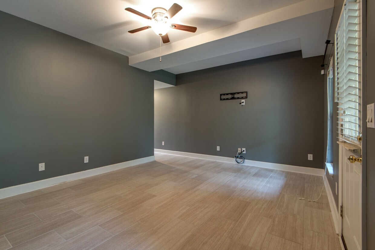 Another view of the bonus room. This room is huge! There is also a half-bath on this level. - 104 Carriage Ct.
