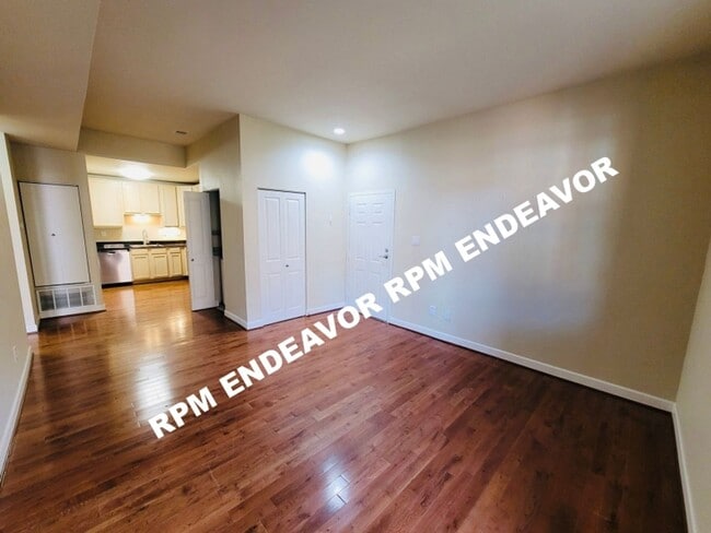 Building Photo - "Charming 2-Bed Condo with Bay Window & Ga...