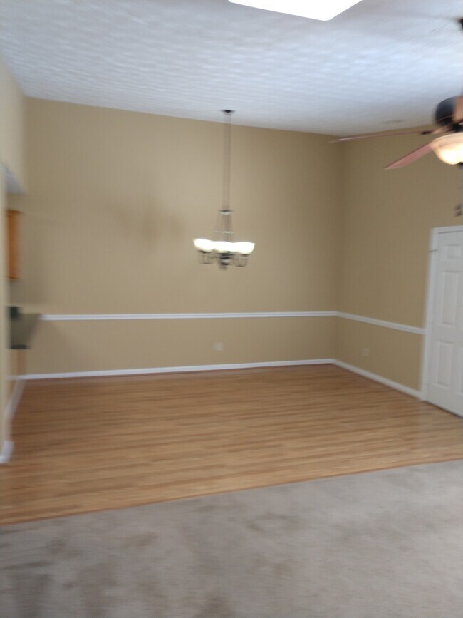 Dining area with wood floors - 155 Courtyard Ln