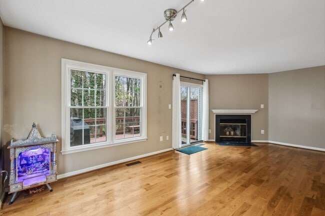 Building Photo - Modern Brick End-Unit Townhome with Stunning Upgrades and Serene Wooded Views